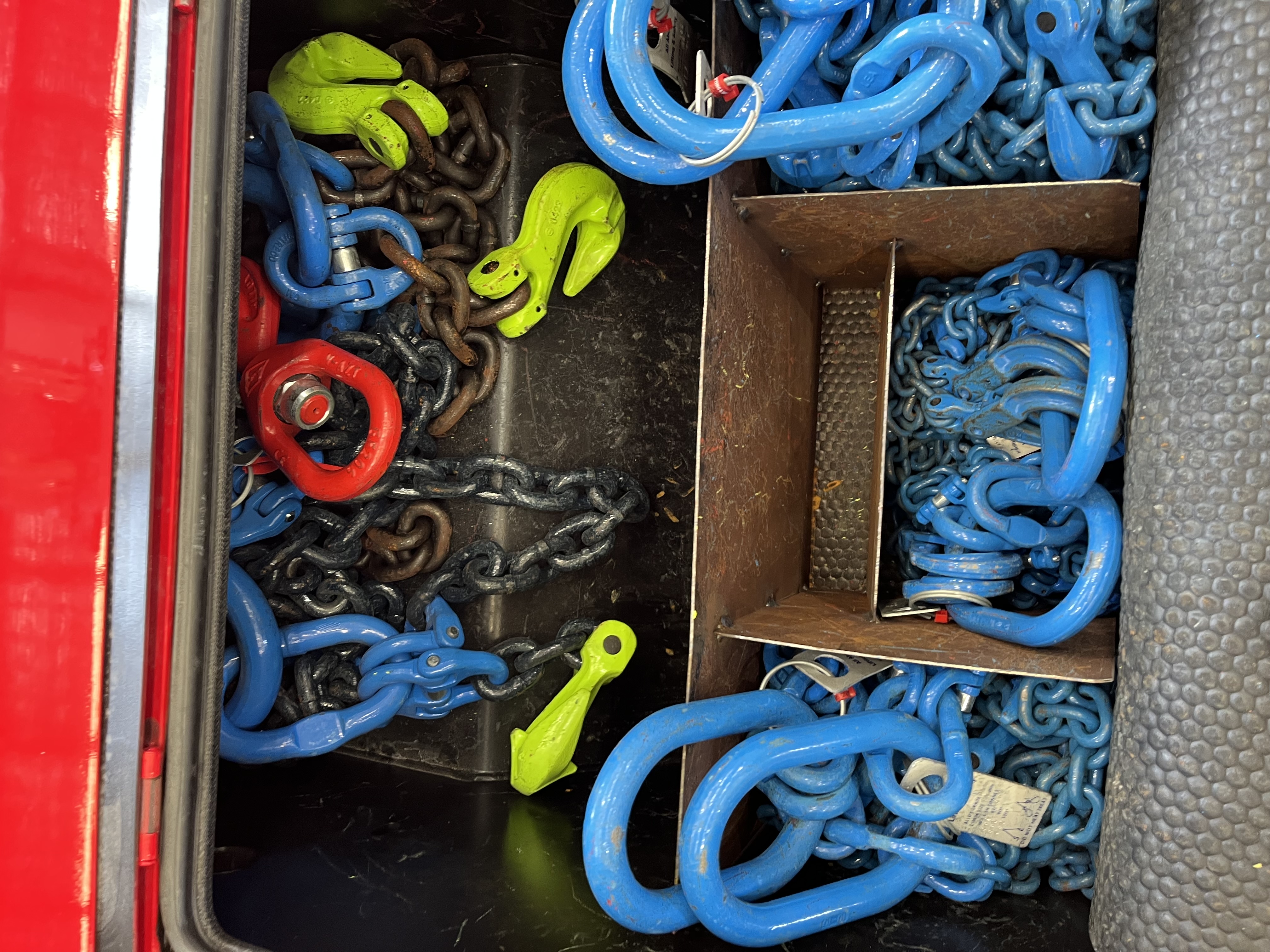 Rigging box containing chains, shackles and lifting hooks
